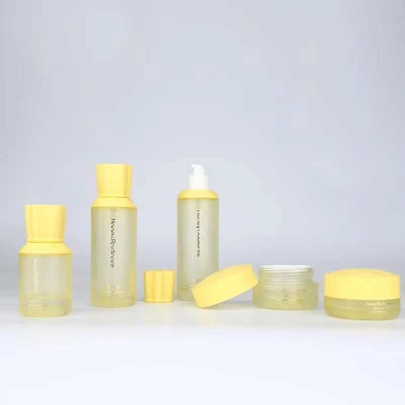 Custom Luxury Skin Care Set 30g 50g 40ml 100ml 120ml Glass Cosmetic Packaging Gradient Yellow Lotion Pump Bottle Face Cream Jar suppliers