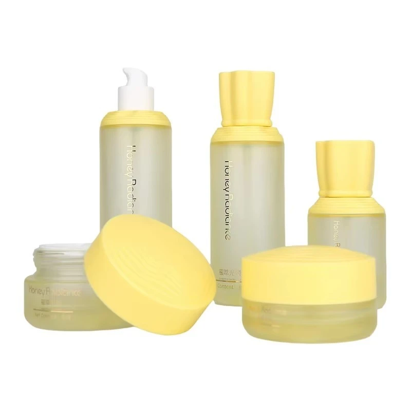Custom Luxury Skin Care Set 30g 50g 40ml 100ml 120ml Glass Cosmetic Packaging Gradient Yellow Lotion Pump Bottle Face Cream Jar factory